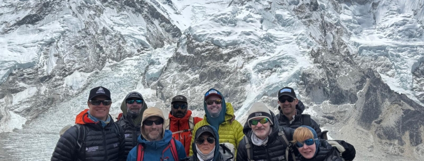The team together on an acclimatization hike above Everest Base Camp with Everest, Lhotse, and Nuptse behind.