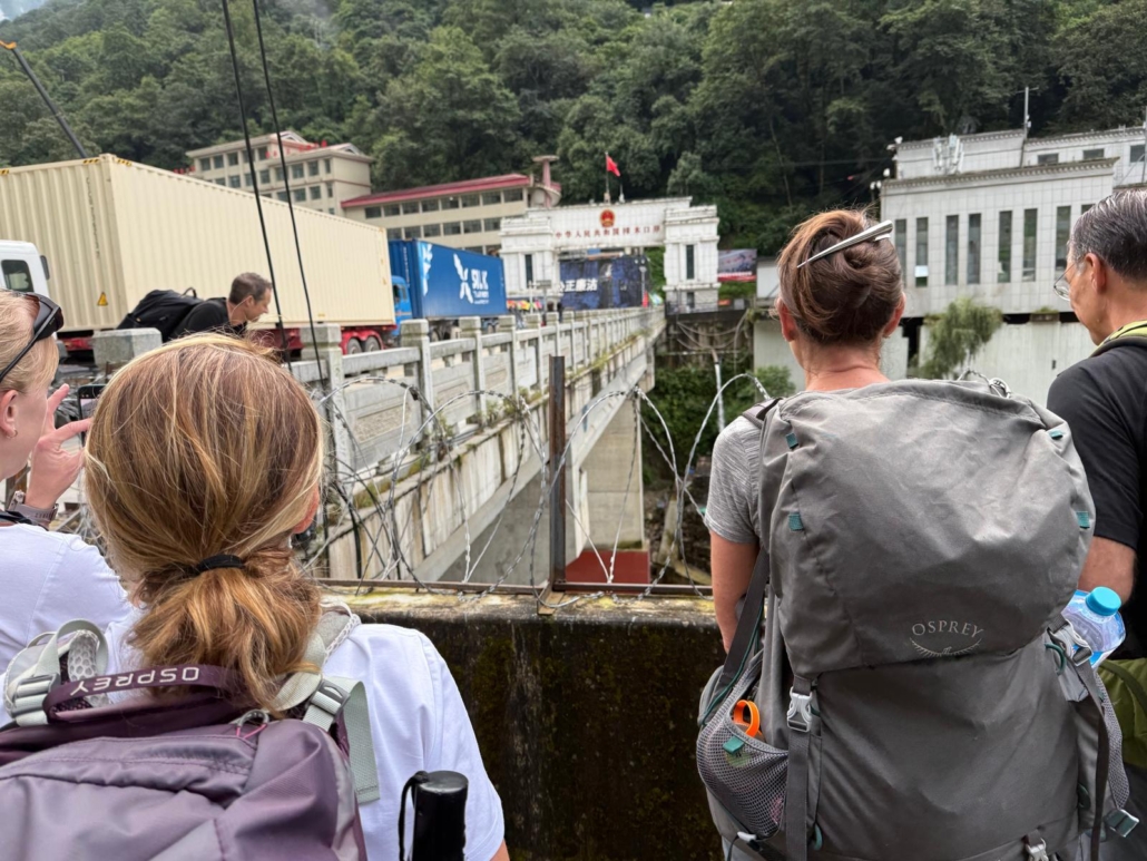 The team waiting at the border crossing (photo by Chris Thompson)
