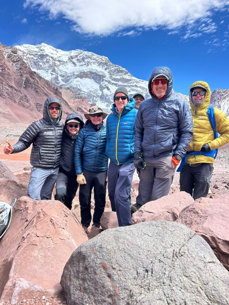 The team under blue skies and with Aconcagua towering high above.