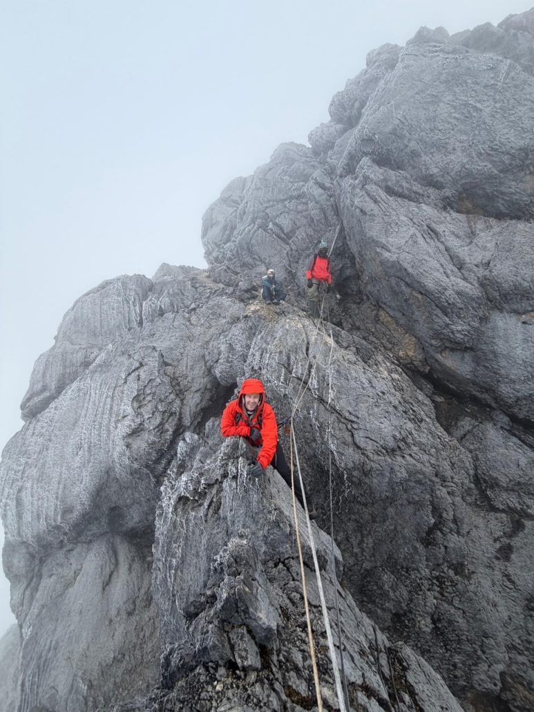 Climbing through the clouds towards the summit