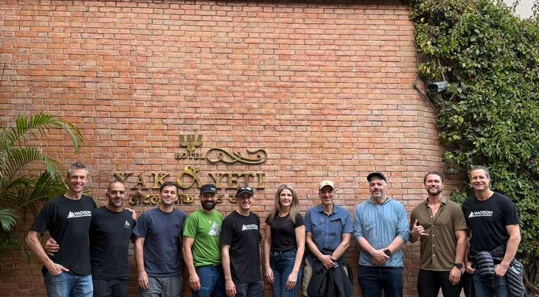Team photo in front of the Yak and Yeti Hotel.