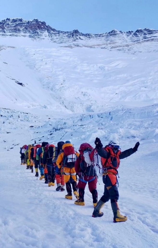 The team moving together beneath the Lhotse Face.