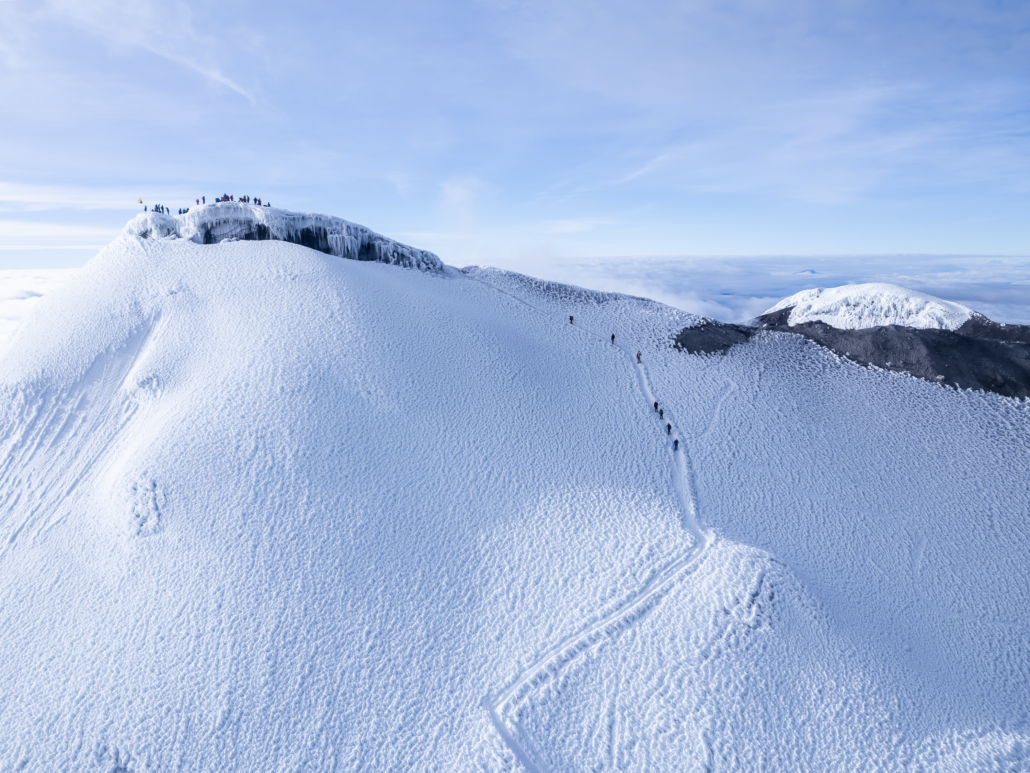 Drone shot of climbers taking the final steps towards the summit of Cotopaxi.