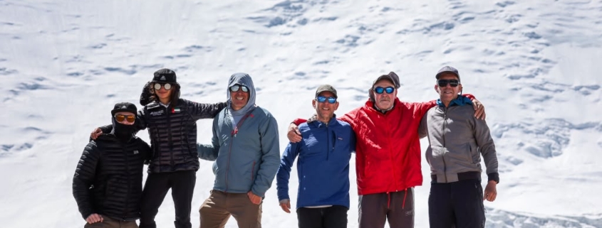 The team on top of Domashniy (Home) Peak with Peak Lenin in the background (photo by Terray Sylvester)