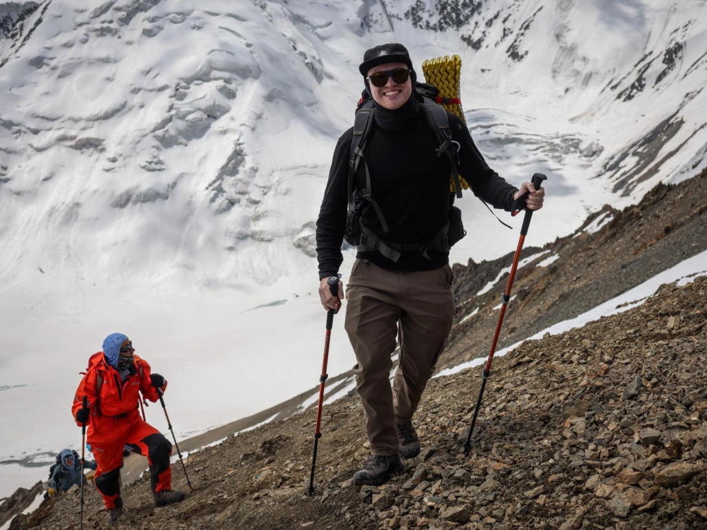 Our climber, Chris, summiting Yukhin Peak (photo by Terray Sylvester)