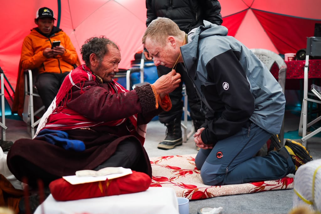Our climber, Woodie, receiving a blessing during the puja (photo by Terray Sylvester)